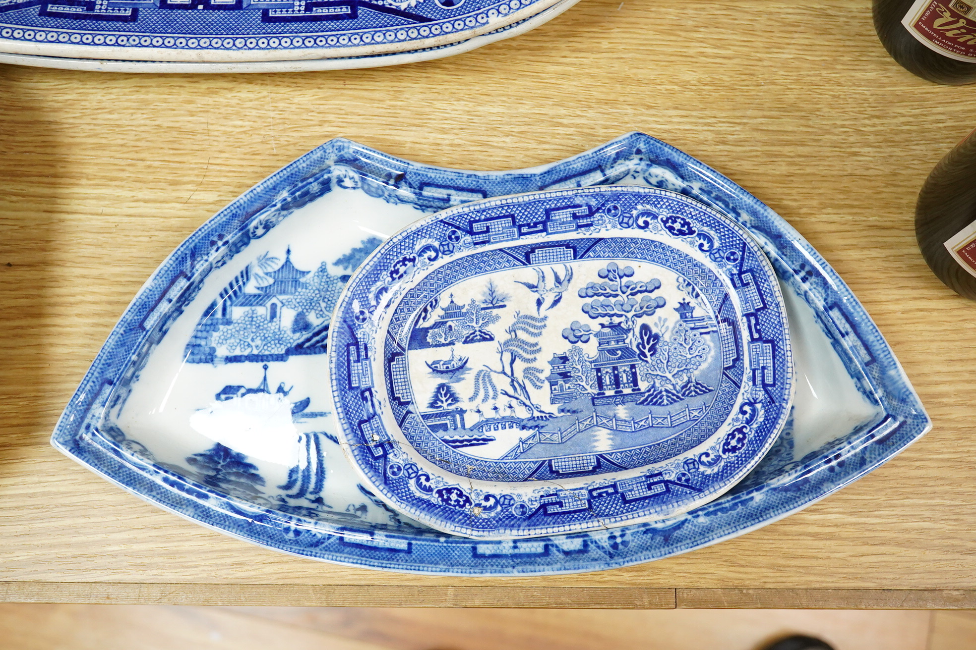 A quantity of Victorian blue and white pottery and a large Worcester jug, meat platters 45cm wide